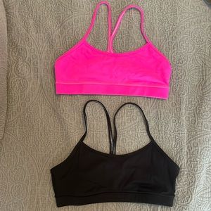 TWO- Flow Y lululemon bras, one black, one pink, size 8
